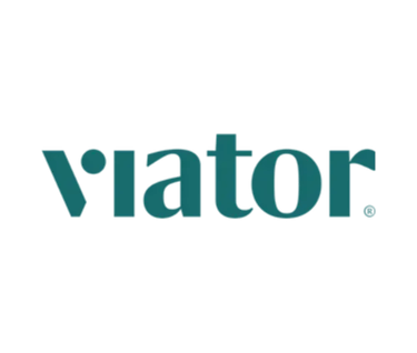 Viator official logo in teal green typeface on a solid black background for travel bookings.