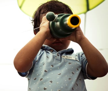 Kid exploring with a magnify glasses