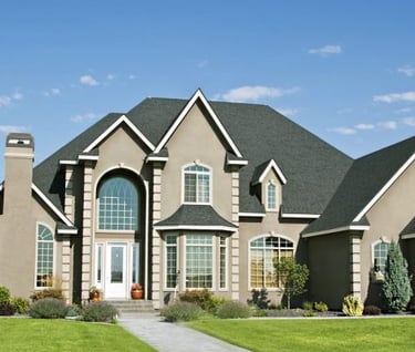 a large house with a nice lawn and a nice house