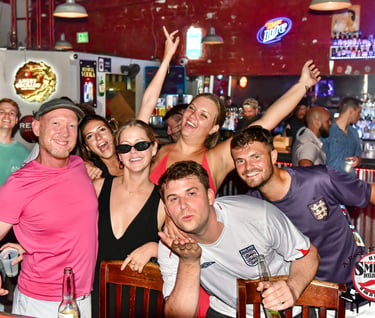 Friends celebrating the groom-to-be at Savannah Smiles with live entertainment, great drinks, and an