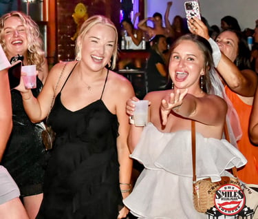 Group celebrating a bachelorette party at Savannah Smiles, a popular dueling piano bar known for liv