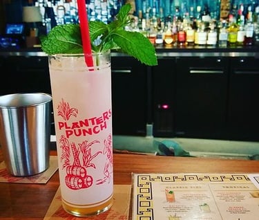 "The planter's punch. The oysters are especially good today, btw." by ursonate is licensed under CC