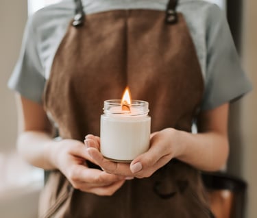 a woman holding a candle in her hands