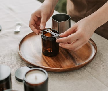 a person is holding a bottle of coffee and a cup of coffee