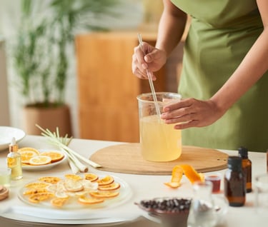 a woman in a green dress is holding a drink
