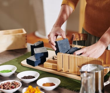 a person is holding a block of soap with a block of soap