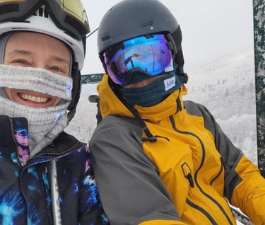 Photo of FACE BASE inventor, Amy, and her partner Steve, wearing FACE BASE prototypes while skiing at Smugglers Notch
