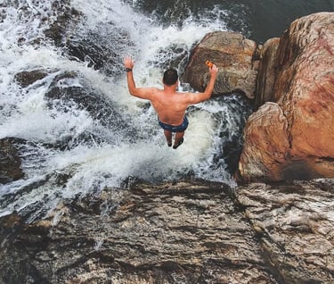jumping into jacuzzi hole at Mkambati Falls