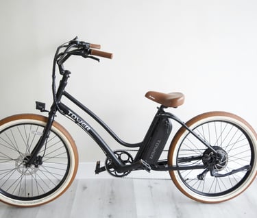 E-bike charging in a hallway, highlighting fire safety risks for UK renters