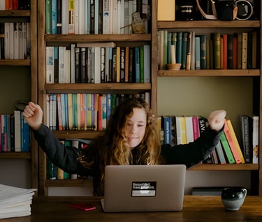 Student celebrating GRE prep achievements at Admit 360, highlighting convenient online classes