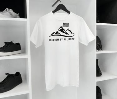 a white t - shirt with a mountain view of a mountain range