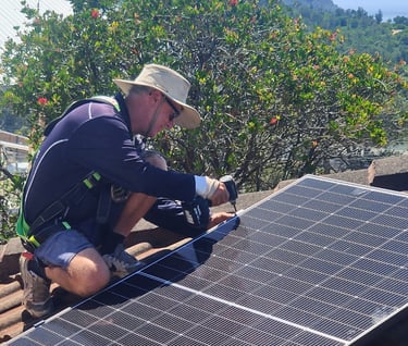 a man installing a solar panel