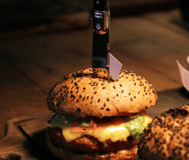 Photo by Michael Wave https://www.pexels.com/photo/close-up-shot-of-two-delicious-hamburgers-on-wooden-chopping-boards-430041