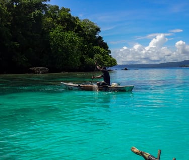 a man in a canoe in the water