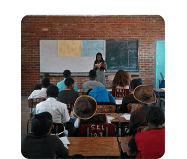 a classroom with a teacher and students in a classroom