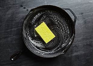 Cleaning a cast iron pan using simple kitchen methods