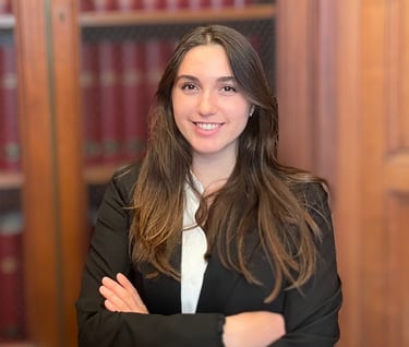 a woman in a suit and tie smiling