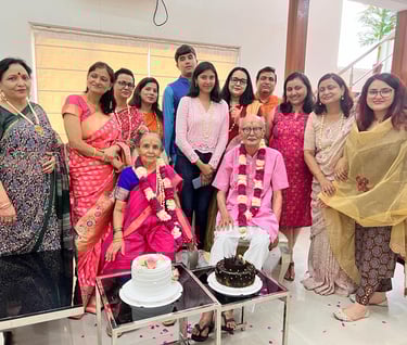 a group of people standing around a cake