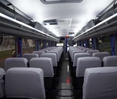 a bus with many seats and chairs in a bus
