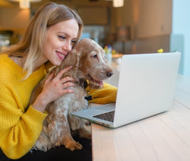 Girl and Dog looking at computer