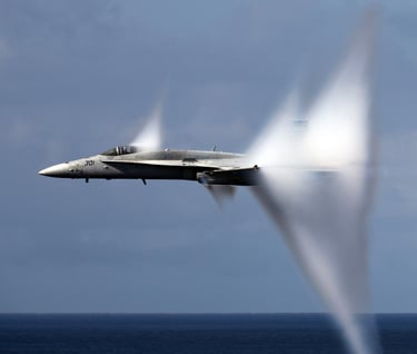 a jet fighter flying through the air
