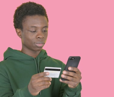 a young man holding a credit card for mobile payment set up