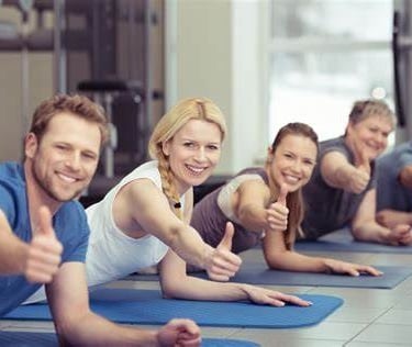 a group of people doing yoga poses