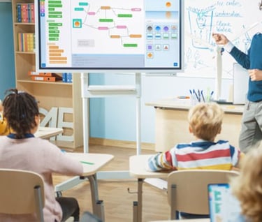 a man standing in front of a class room