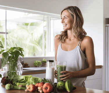 Woman blending fruit and vegetable juice