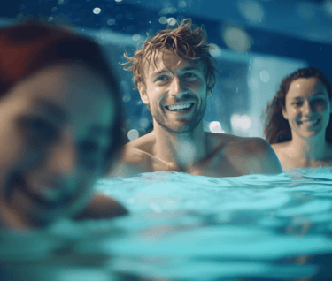 Group of men and women enjoying swimming at the public pool