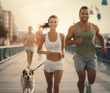 Group of men and women jogging on the boardwalk at the beach
