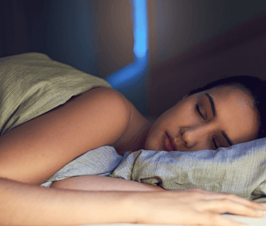 Woman sleeping soundly in bed