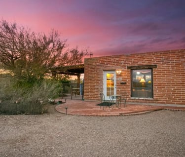 a brick building with a patio and a patio