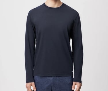 a man in a black shirt and pants with a black shirt