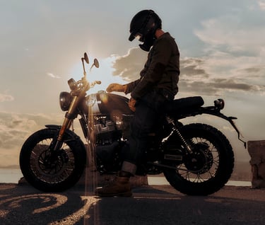 a man in a helmet and a helmet on a motorcycle