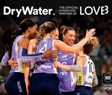 a group of women's volleyball players are all smiles and cheer 