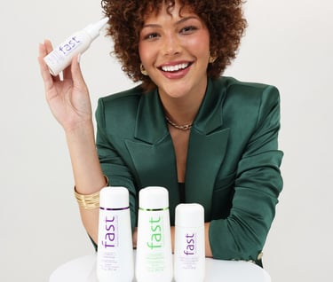 a woman in a green suit and a bottle of hair