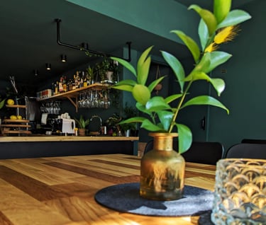 a vase with a plant in it sitting on a table