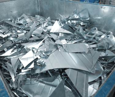 a metal container filled with metal foil 