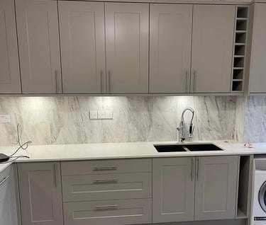 Modern grey shaker kitchen cabinets with integrated washing machine by Roman Refurbs