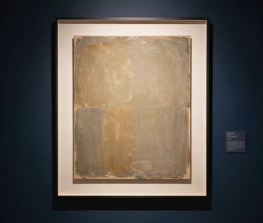 A lifestyle photograph of a modern, quiet gallery space. On a Midnight Navy wall, a large backlit art piece glows softly with Muted Gold light, casting a sophisticated and innovative atmosphere over the room.