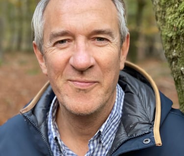 Well workplace specialist in a blue jacket posing for a photo