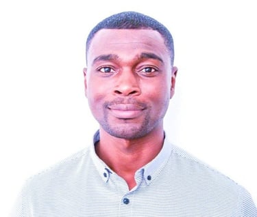 Employee health expert in a white shirt, posing for a photo