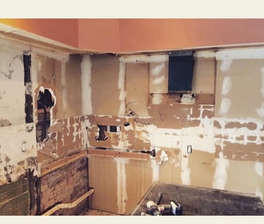 a kitchen with cabinets torn out