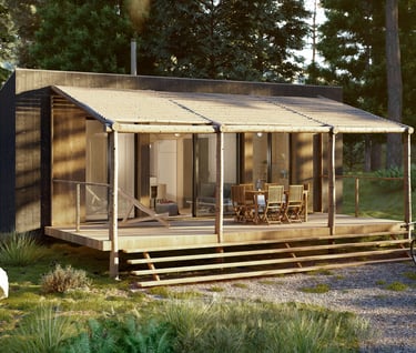 a small cabin with a porch and a patio table