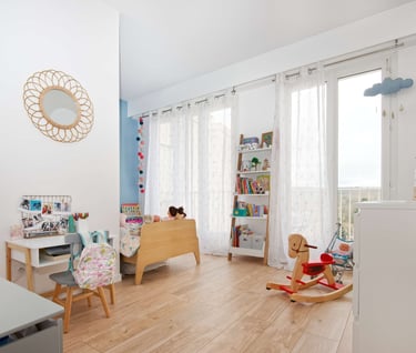 a child's room with a rocking chair and a rocking chair
