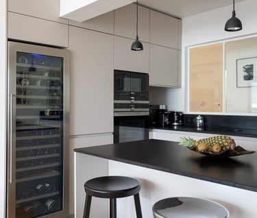a kitchen with a wine cooler and a wine cooler
