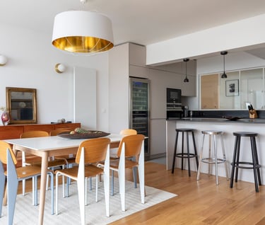 a dining room with a table and chairs