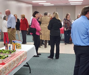 People standing and socializing at church