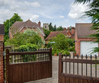 A double set of wooden gates swinging open by automation